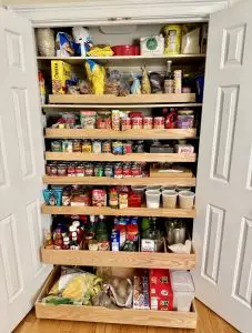 Pull-out drawers installed in a closet pantry designed for maximum storage