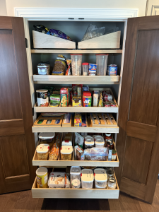 Custom drawers installed in a closet pantry to maximize storage